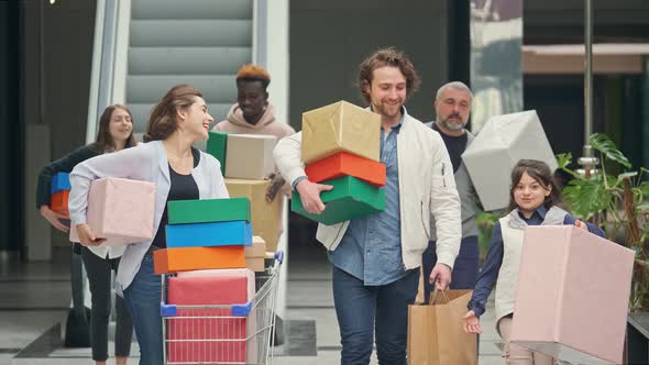 Happy Group of People Spending Weekends in the Shopping Mall