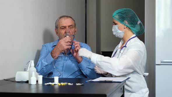 Female Doctor Helps Senior Patient Nebulizer