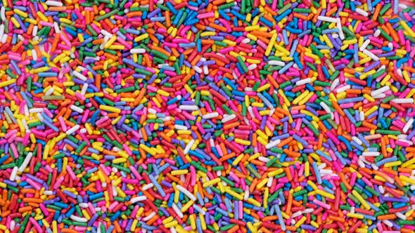 Rotating Background of Multicolored Sprinkles for Sweets