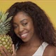 Positive African American Woman with Pineapple - VideoHive Item for Sale