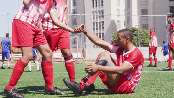 Soccer player with prosthetic leg with soccer team