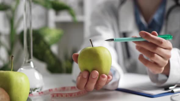 Doctor Explains The Usefulness And Benefits Of The Apple Fruit. Patient The Appointment With