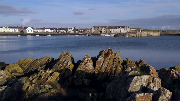 A view of the small Scottish village of Isle of Whithorn in Dumfries and Galloway with small boats a