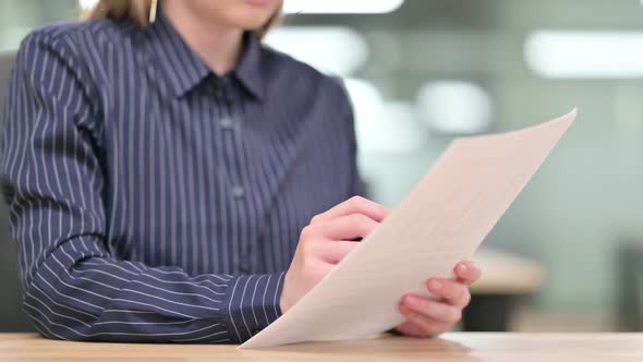 Close Up of Businesswoman Reading Documents