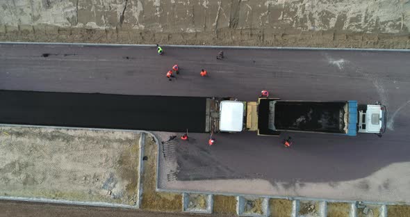 Top View Of An Asphalt Road Getting Done By The Workers