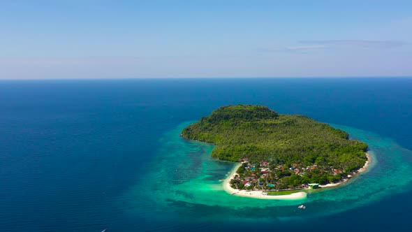 Himokilan Island, Leyte Island, Philippines. Tropical Island with a Village and a White Beach.