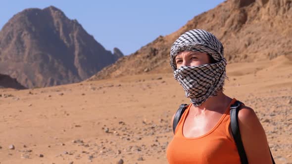 Girl in the Keffiyeh in Desert of Egypt