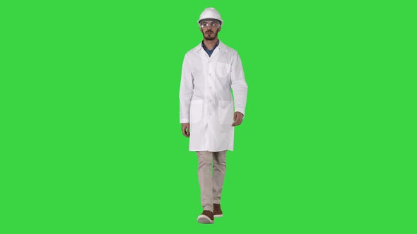 Science engineer walking in safety helmet and glasses on