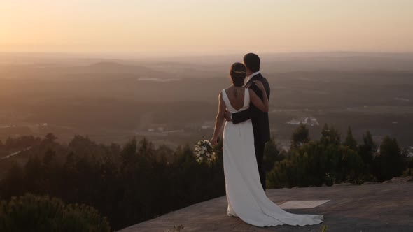 Fresh married couple in the sunset