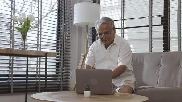 Middle-aged male demonstrating joy in using portable technology.