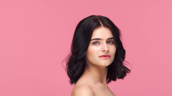 Studio portrait of young and beautiful brunette woman.