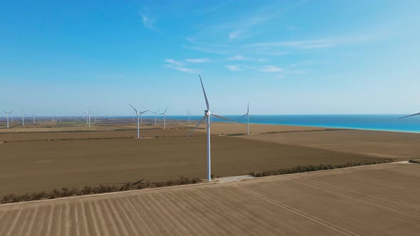 Wind Turbine Farm on Beautiful Clear Morning Rural Seaside Landscape