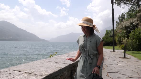 Pretty lady cherishing a solo vacation at Brissago Switzerland