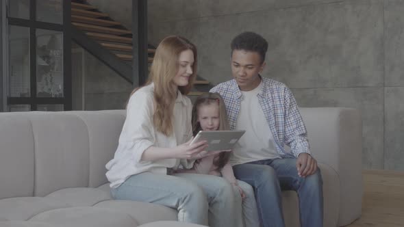 Beautiful Young International Family at Home, African American Man, Caucasian Woman and Small Girl