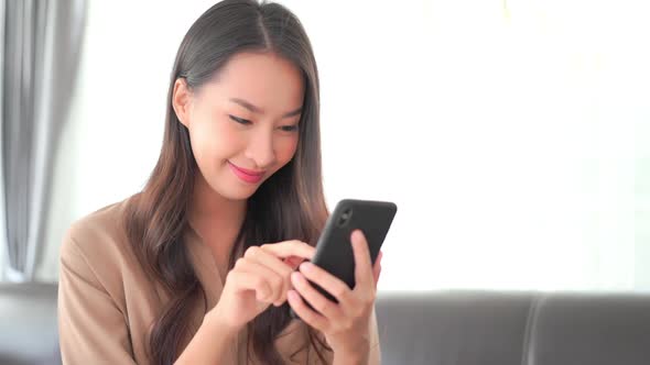 Young asian woman use smart phone