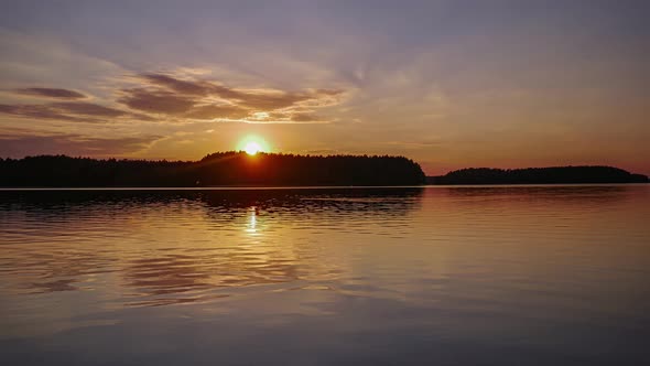 Sunset Over Lake Time Lapse. Colorful Sunset Sky. Lake Wdzydze, Kashubia,Poland.