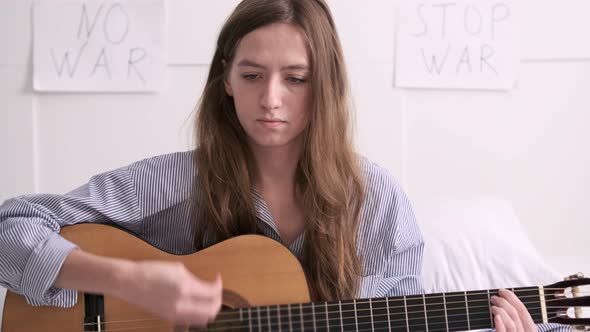 Woman Plays Guitar