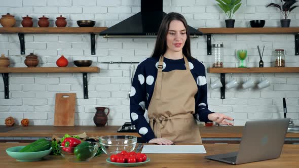 Smiling woman study online videocall laptop, tells teacher show vegetable webcam