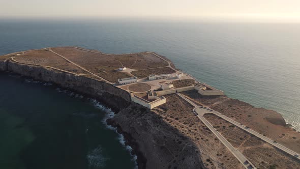 Bright hazy sun with endless stretch of the ocean in Fortaleza de Sagres fortress Algarve Portugal.