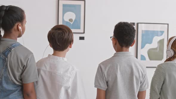 Children Using Audio Guide in Gallery