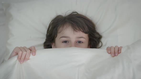 Scared child in bed