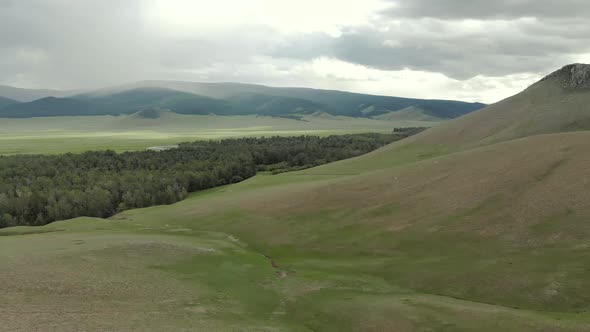 Trees, Forest and Vast Meadow in The Big River in Wide Valley of Asia Geography