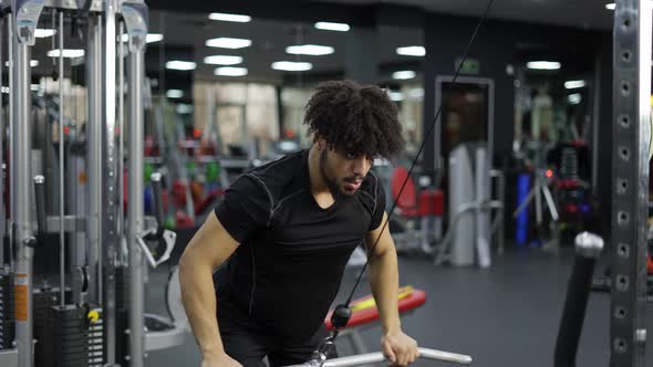 Young Man Exercising on Lateral Pull at Gym for the Back Mucles Slow Motion