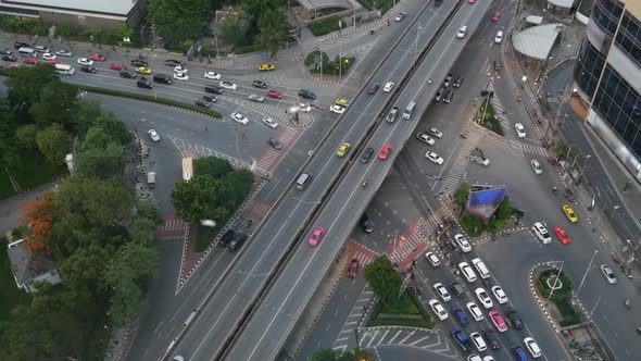 Traffic on Crossroad on Street. From Above Modern Cars and Motorcycles Driving on Intersection on