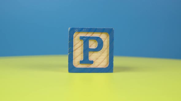 Close up shot letter "P" alphabet wooden block