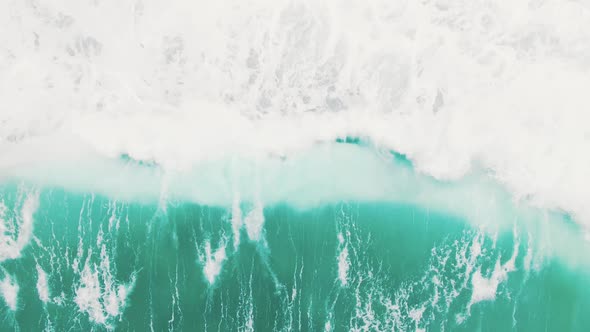 Boundless Turquoise Ocean Waves Move on White Foamy Surface