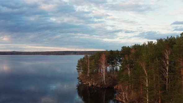 Aerial View of the Natural Landscape Forest on the Lake Shore at Sunset