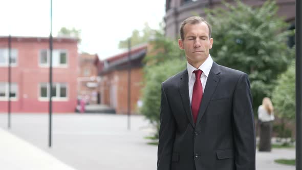 Businessman Standing Outside Office