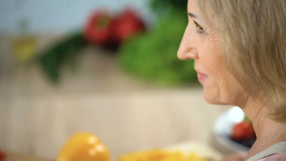 Happy Old Couple Cutting Vegetables at Cooking Classes, Common Interests, Flirt