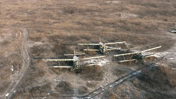 Three Broken Transport Planes on the Airfield  Light Transport Aircrafts Biplanes on the Airfield