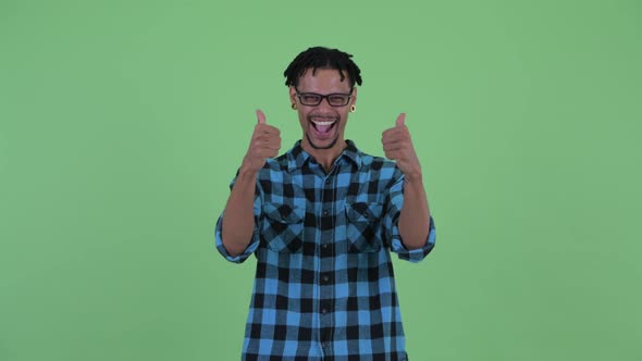 Happy Young African Hipster Man Giving Thumbs Up and Looking Excited