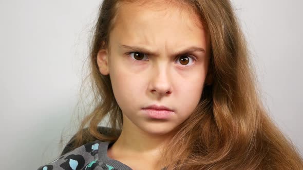 Emotional Teenage Girl Raising Eyebrow. Surprised Girl Raises Eyebrow