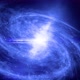 4k video animation. Zoom in. A large galaxy rotates and emits bright blue light.  - VideoHive Item for Sale