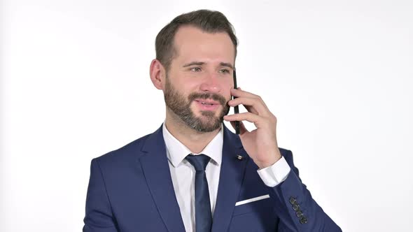 Businessman Talking on Smartphone, White Background