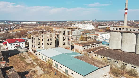 View of abandoned industrial place. Aerial view of abandoned industrial buildings through cityscape