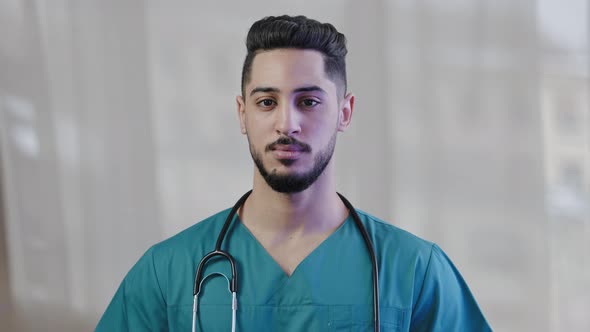 Confident Arabian Hispanic Man Intern Practitioner Male Nurse Surgeon Wear Medical Uniform with