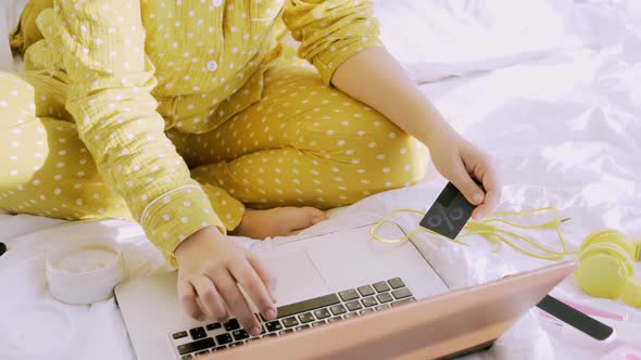 Woman in Yellow Pajama Shopping Online