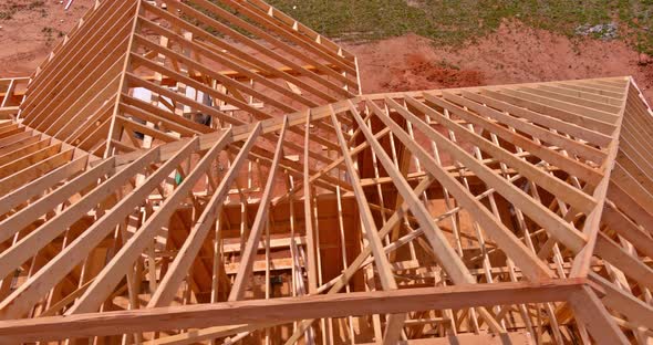Attic Construction in Wooden Roof Frame Truss System on New House
