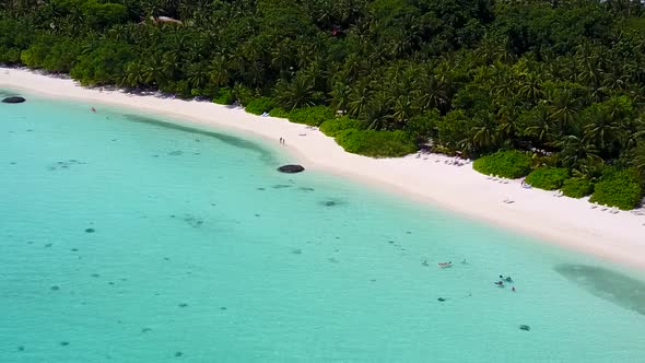 Aerial drone scenery of exotic tourist beach by blue water with sand background