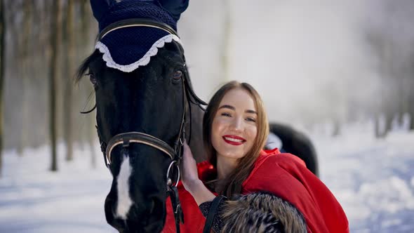 Real Time Video of Charming Smiling Princess From Fairytale Hugging, Petting and Holding Black