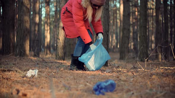 Cleaner Woman Collecting Trash In Forest. Trash Volunteer Eco Activist. Save Planet.