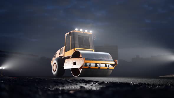 The big yellow roller on the asphalt road at night. Huge vehicle ready to work.