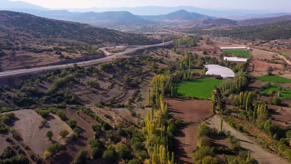 Beautiful Rural Landscape with Agricultural Fields Mountains and a Road