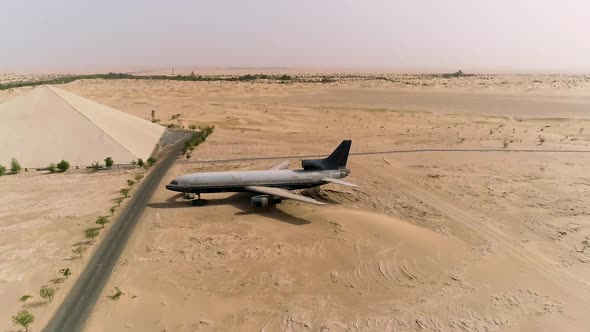 Aerial view of museum airplane on desert landscape, Abu Dhabi, U.A.E