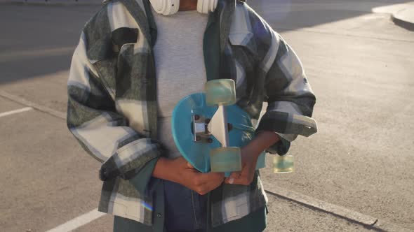 Cropped Person Holding Plastic Skateboard