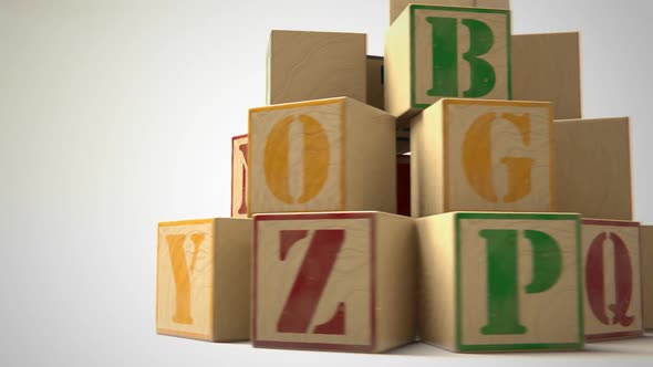 Blocks with colorful letters. Toys used to teach children spelling and writing.